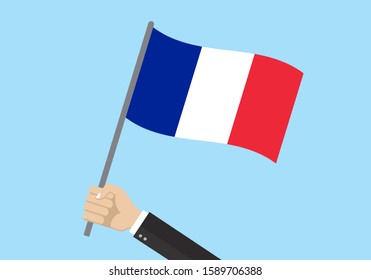 France waving flag. Hand holding French flag. National symbol. Vector illustration.