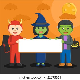 frankestein devil man and witch holding board