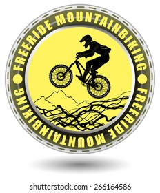 Free ride mountain biking club emblem. Rounded club emblem with a rider silhouette and abstract landscape.