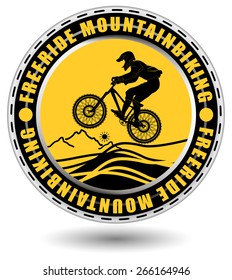 Free ride mountain biking club emblem. Rounded club emblem with a rider silhouette and abstract landscape.