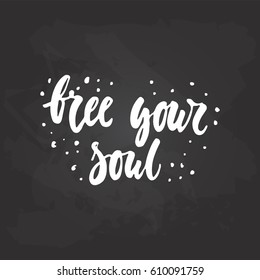 Free your soul - hand drawn lettering phrase on the black chalkboard background. Fun brush ink inscription for photo overlays, greeting card or t-shirt print, poster design