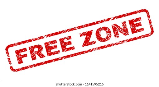 FREE ZONE stamp seal print with scratced style. Red vector rubber print of FREE ZONE label with corroded texture. Text label is placed inside rounded rectangle frame.