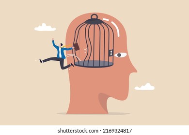 Freedom, break free from prison of thinking, inspiration or think out of the box, psychology or mental therapy, emotional concept, confidence businessman jump out of cage in his head for freedom.
