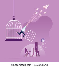 Freedom concept. Businessman escape from birdcage by paper plane