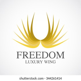 Freedom of gold feather wing abstract vector and logo design or template luxury fly business icon of company identity symbol concept