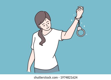 Freedom and release concept. Young positive girl cartoon character standing and looking at handcuffs an her hand feeling cute and confident to release vector illustration 