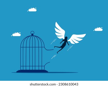 Freedom. woman with wings flying out of the cage