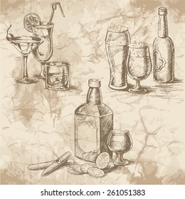 Freehand drawing on the old paper. Stemware glasses with cocktails and beer, a bottle of whiskey, lemons and cigars. Vintage style of food design.