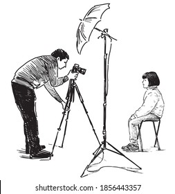 
Freehand drawing of a professional photographer photographing little girl in his studio