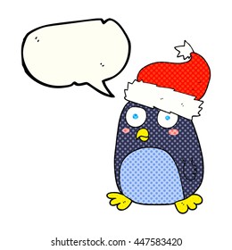freehand drawn comic book speech bubble cartoon penguin in christmas hat