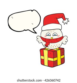 freehand drawn speech bubble cartoon cute christmas owl on wrapped present
