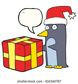 freehand drawn speech bubble cartoon christmas penguin with present