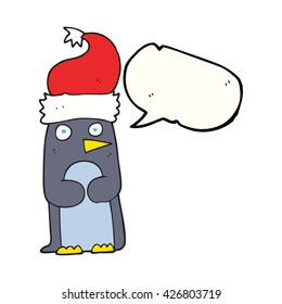 freehand drawn speech bubble cartoon penguin in christmas hat