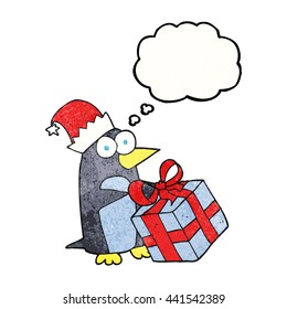 freehand drawn thought bubble textured cartoon christmas penguin