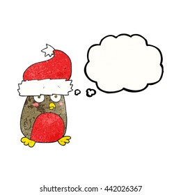 freehand drawn thought bubble textured cartoon christmas robin wearing christmas hat
