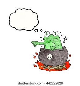 freehand drawn thought bubble textured cartoon halloween toad in cauldron