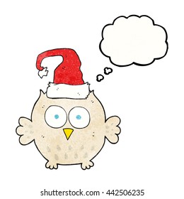 freehand drawn thought bubble textured cartoon owl wearing christmas hat