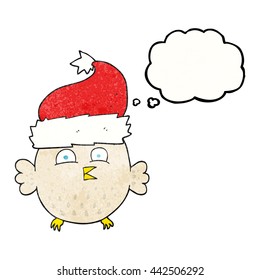 freehand drawn thought bubble textured cartoon owl wearing christmas hat