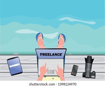 Freelance concept. Freelancer-photographer working with laptop near the sea