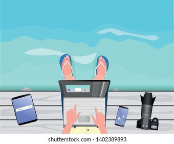 Freelance concept. Freelancer-photographer-illustrator-stocker working with laptop near the sea