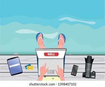 Freelance concept. Freelancer-photographer-stocker working with laptop near the sea