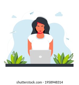 Freelance, online studying, work from home concept. girl sitting with laptop. The girl sits at the table and works on a laptop with a home plant in the background. freelance concept