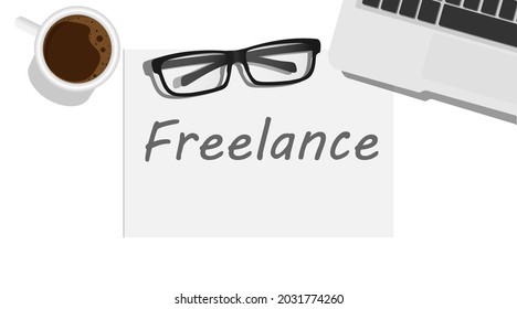 Freelance written on white paper with coffee cup eyeglasses and laptop