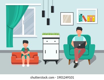 Freelancer. Father with small child working from home on a laptop sitting on the couch. Home Office