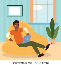 freelancer man with laptop on bean chair