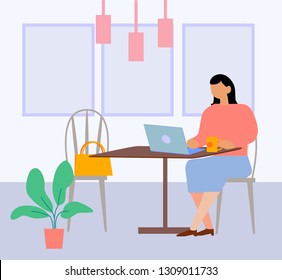 Freelancer woman using laptop computer sitting sittingsitting in at a table in a cafe. Concept of working at home. Female blogger.