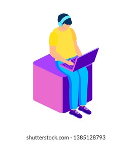 Freelancer working with laptop seated on cube