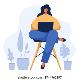 Freelancer working on her notebook, distant employee while quarantine and isolation. There are plants nearby. Vector illustration of a young woman typing from home office with her laptop on her laps.