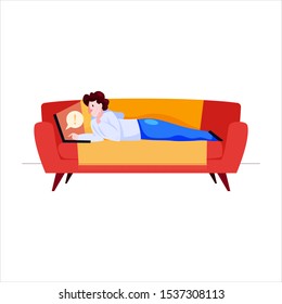 Freelancer working on sofa at home. Male holding a laptop. Concept of freelance lifestyle.