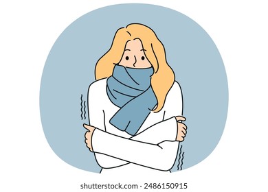 Freezing woman with scarf around neck is shivering from cold and needs warm clothes or climate equipment. Freezing girl suffers from sudden change in temperature and onset of winter