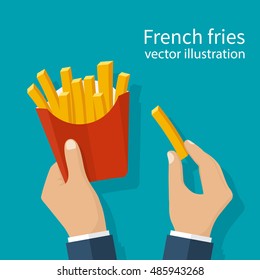 French fries in hands of men. French fries in paper box. Isolated on background.