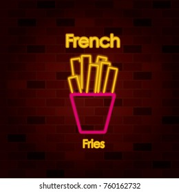 french fries on neon sign on brick wall