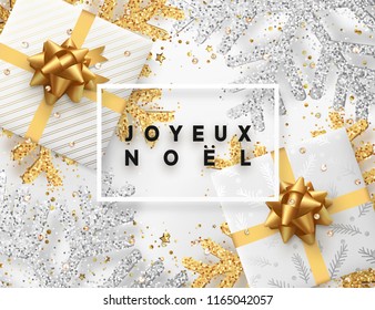 French lettering Joyeux Noel(Translation Happy New Year and Merry Christmas) . Christmas background with gifts box and shining golden and silver snowflakes. Xmas Greeting card. Vector Illustration.