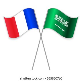 French and Saudi Arabian crossed flags. France combined with Saudi Arabia isolated on white. Language learning, international business or travel concept.