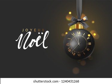 	
French text Joyeux Noel, Merry Christmas and Happy New Year. Xmas golden balls. Festive xmas decoration gold bauble, hanging on the ribbon