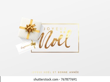 French Text Joyeux Noel. Merry Christmas Gold Lettering In A Frame Background.