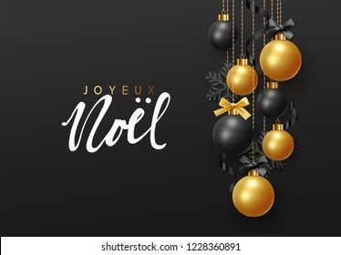 French text Joyeux Noel. (Translation Merry Christmas and Happy New Year.) Background hanging gold and black balls with ribbon and bow. Xmas greeting card with decorative bauble