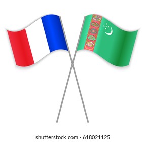 French and Turkmen crossed flags. France combined with Turkmenistan isolated on white. Language learning, international business or travel concept.