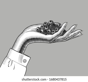 Fresh berries in women's hand on a solid background. Hand holding fresh berries.