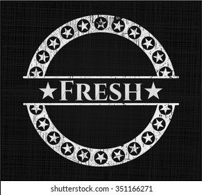 Fresh chalkboard emblem on black board