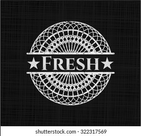 Fresh chalkboard emblem written on a blackboard