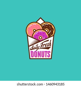 Fresh donuts logo. Multi color Donuts into paper bag. Vintage lettering. Bakery and street food icon.