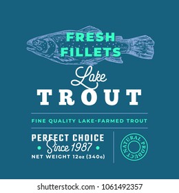 Fresh Fillets Premium Quality Label . Abstract Vector Fish Packaging Design Layout. Retro Typography with Borders and Hand Drawn Lake Trout Silhouette Background.