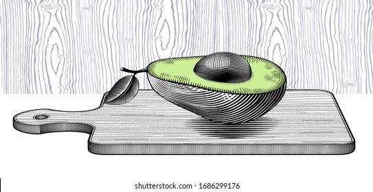 Fresh organic avocado on old wooden table. Vintage engraving stylized as drawing. 