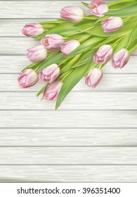 Fresh pink tulips and empty tag for text on wooden background. EPS 10 vector file included