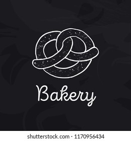 Fresh pretzel. Logo for oktoberfest or bakery on black chalkboard. Doodle icon for Oktoberfest festival. Hand-drawn design element for label and poster